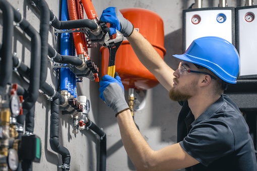 Boiler Service Boiler service technician inspecting a boiler