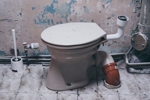 Replacing Toilet Drain Pipe Plumber replacing a toilet drain pipe