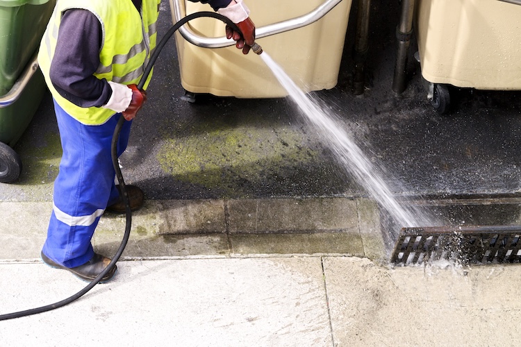 Professional worker with pressurized water of service Hydro Jetting Services